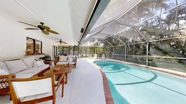 a view of swimming pool with seating area