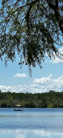 a view of mountain with sunset in background