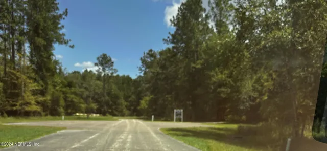 a view of swimming pool and trees