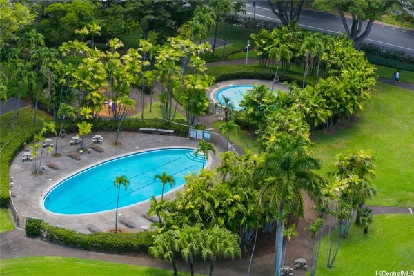 an aerial view of a house with swimming pool garden and patio