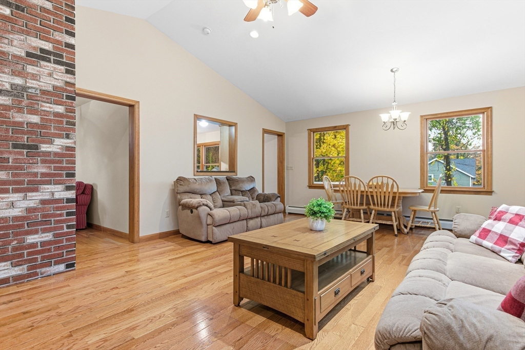 7 John Street Southborough, MA 01772 - Photo 12 of 30 a living room with furniture and a chandelier