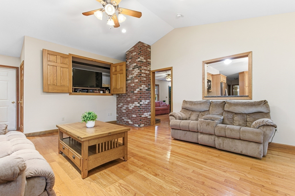 7 John Street Southborough, MA 01772 - Photo 13 of 30 a living room with furniture and a flat screen tv