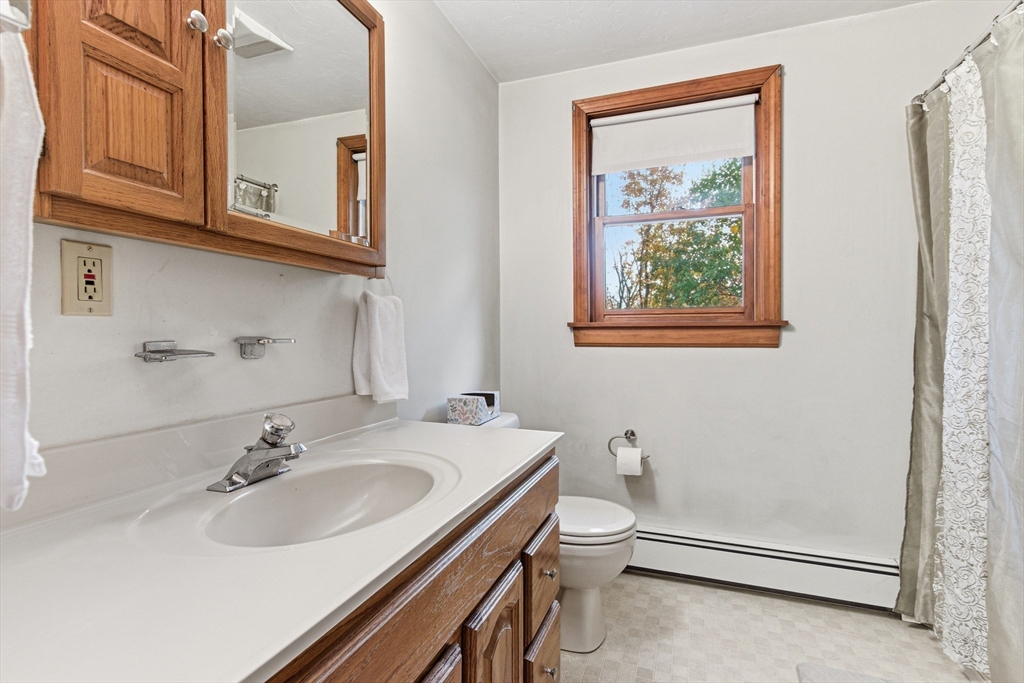 7 John Street Southborough, MA 01772 - Photo 17 of 30 a bathroom with a sink and a mirror