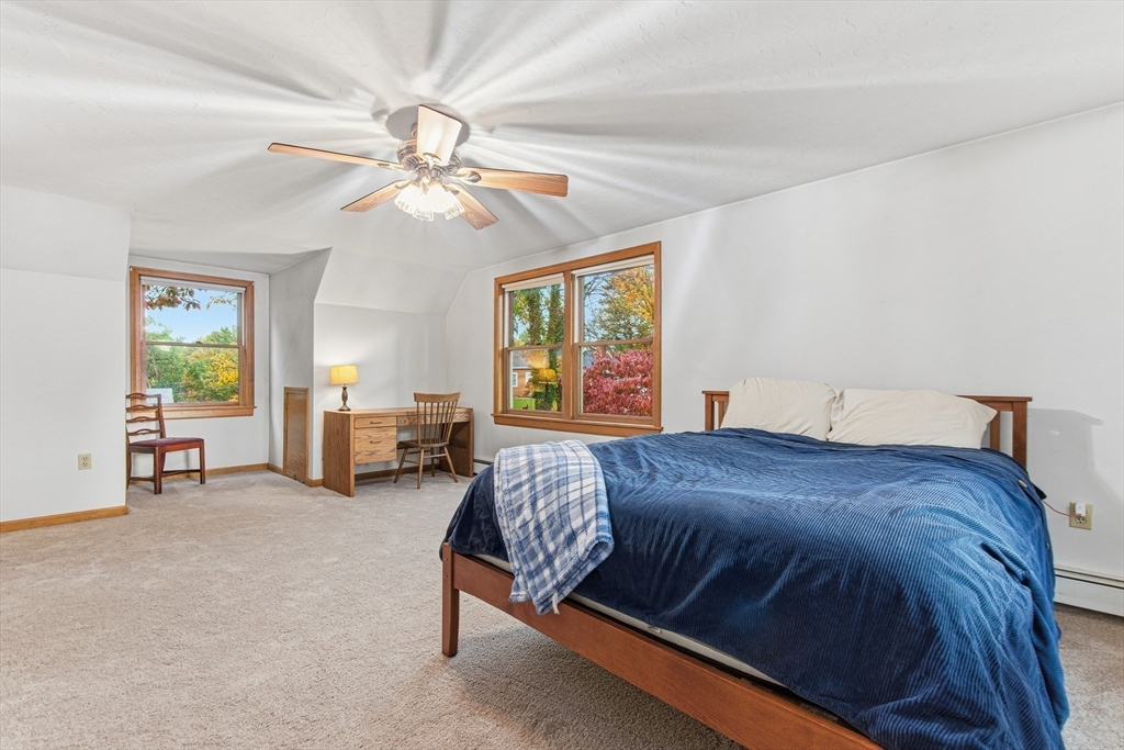 7 John Street Southborough, MA 01772 - Photo 20 of 30 a bedroom with a bed and a chandelier