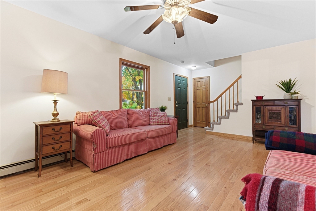 7 John Street Southborough, MA 01772 - Photo 2 of 30 a living room with furniture a ceiling fan and a rug