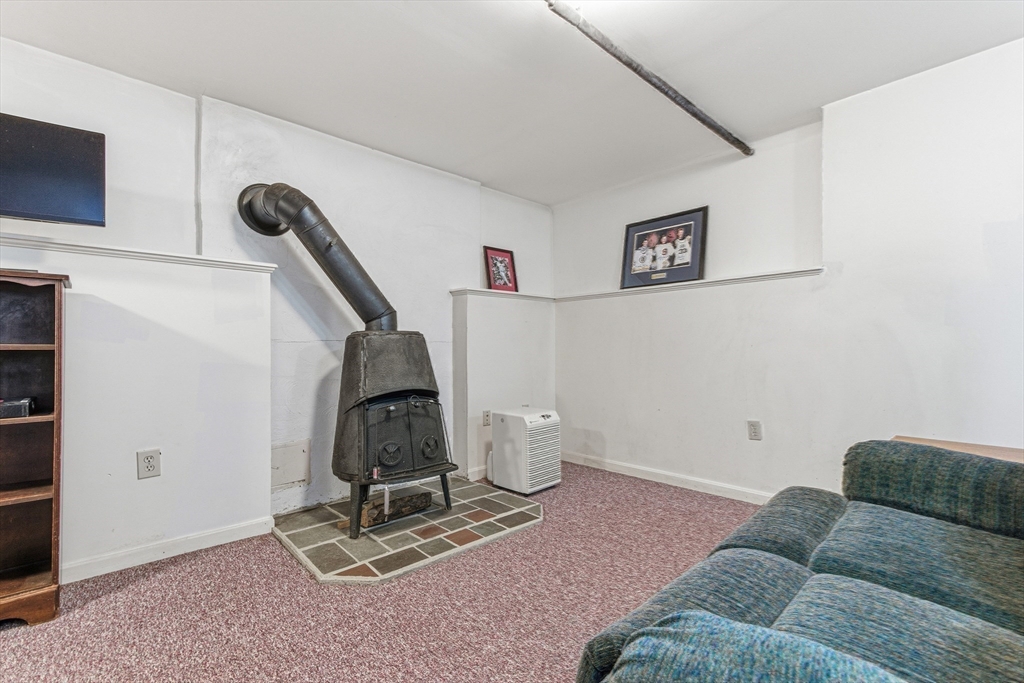 7 John Street Southborough, MA 01772 - Photo 24 of 30 a living room with furniture and a air conditioner vent