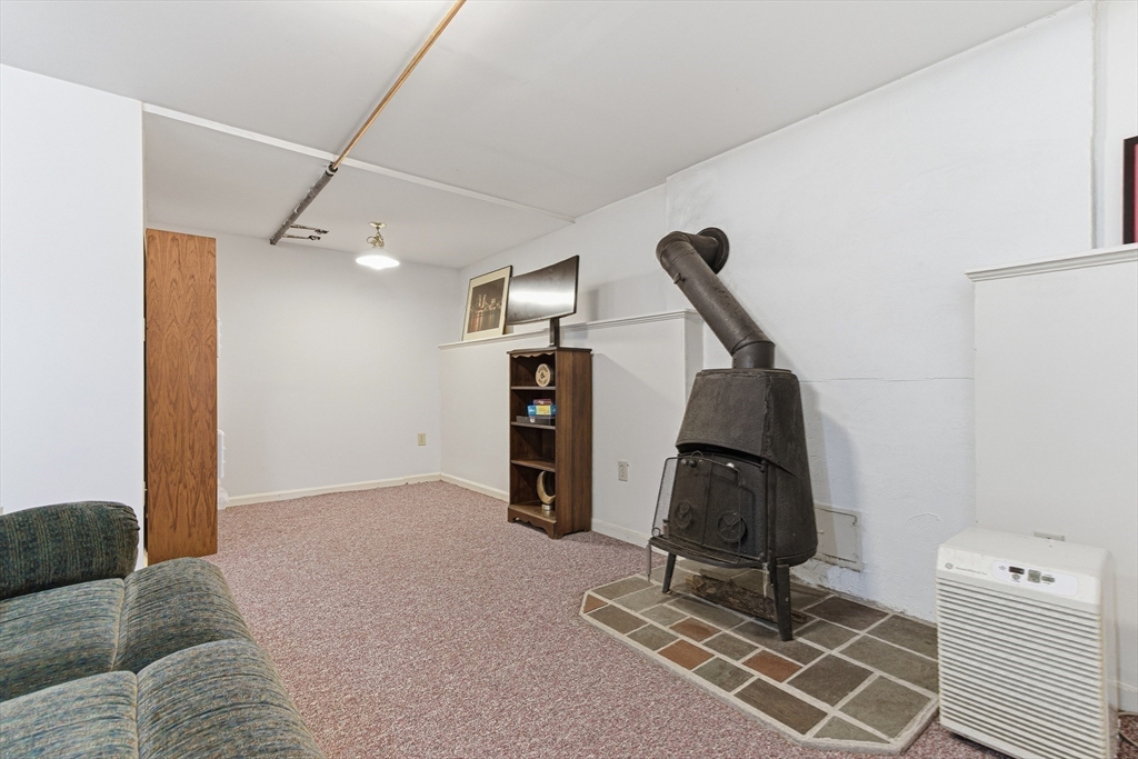 7 John Street Southborough, MA 01772 - Photo 25 of 30 a view of a livingroom with furniture and gym equipment