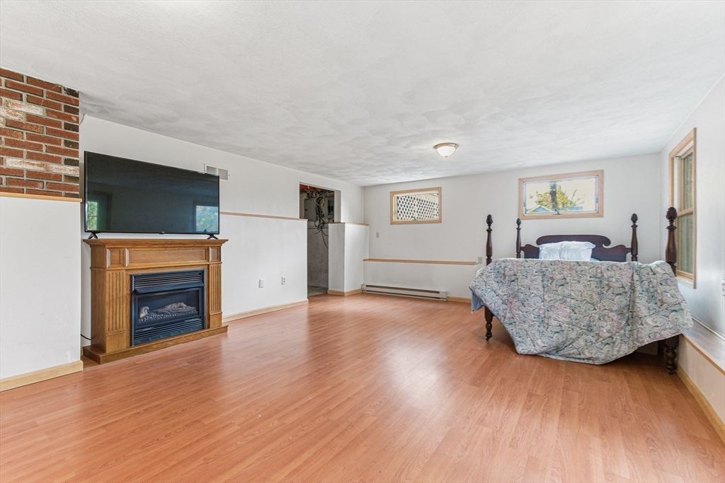 7 John Street Southborough, MA 01772 - Photo 27 of 30 a living room with furniture and a fireplace