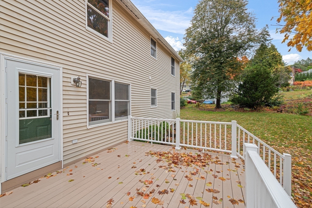 7 John Street Southborough, MA 01772 - Photo 28 of 30 a view of deck with wooden floor and fence next to a yard