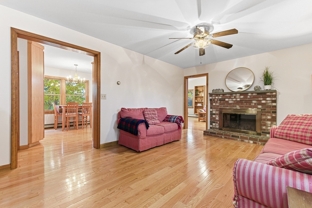 7 John Street Southborough, MA 01772 - Photo 3 of 30 a living room with furniture a fireplace and a flat screen tv