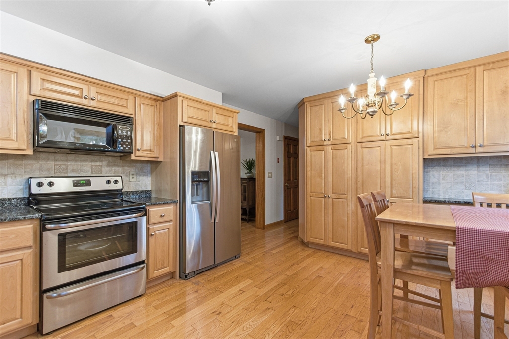 7 John Street Southborough, MA 01772 - Photo 5 of 30 a kitchen with stainless steel appliances a stove a refrigerator and a microwave