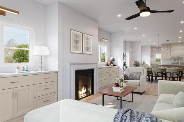 a living room with furniture a fireplace and a potted plant