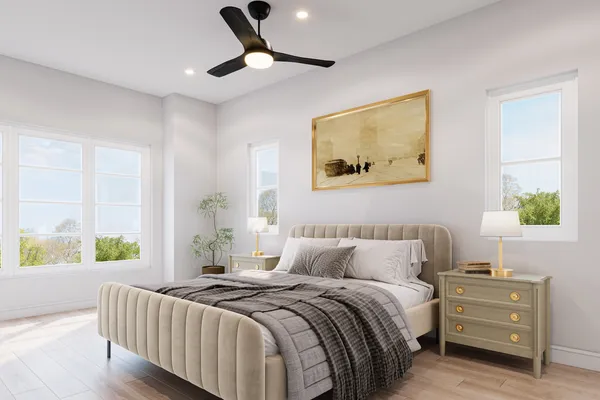 a bedroom with a bed and a painting on the wall