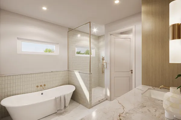 a spacious bathroom with a tub sink and shower