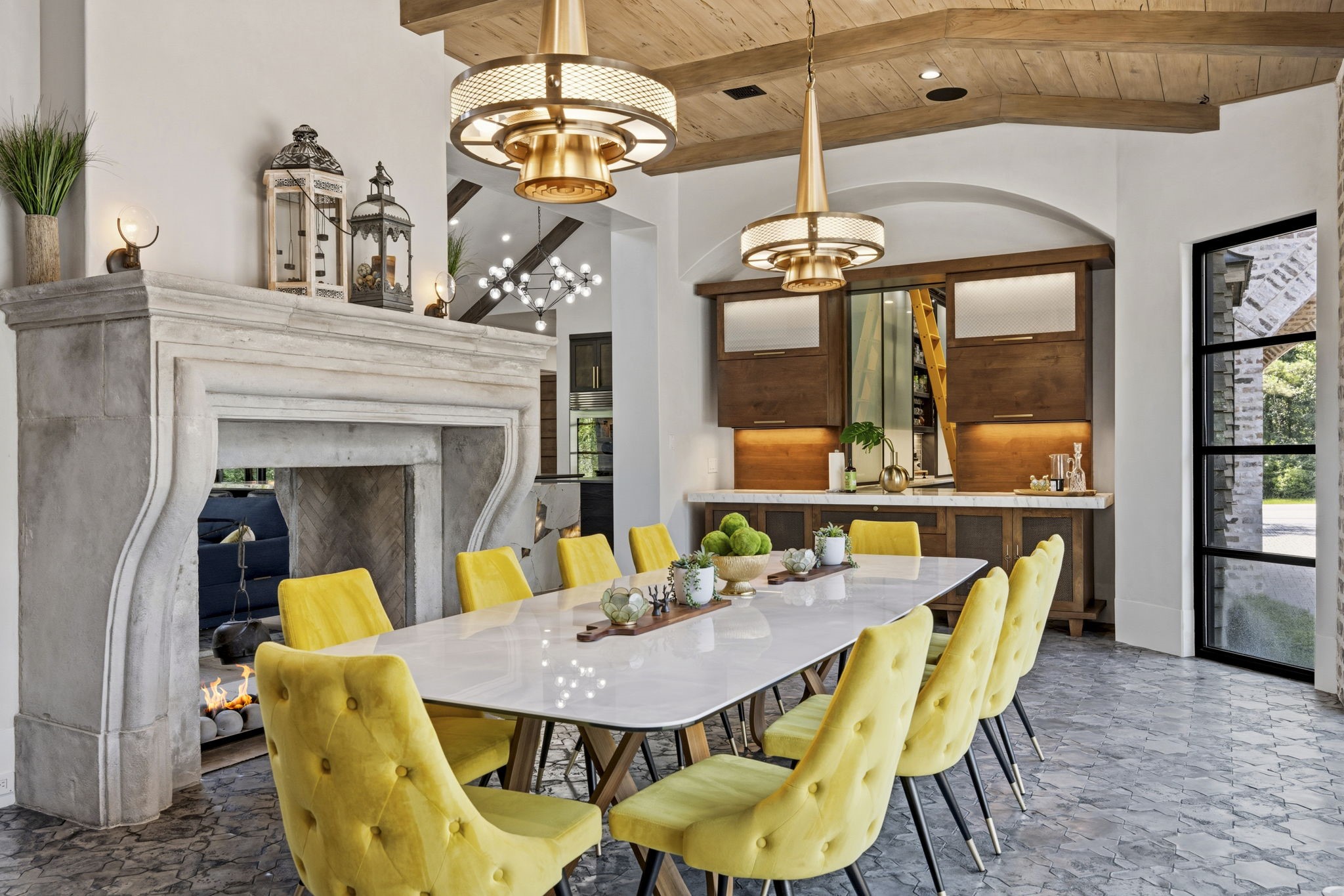 27006 Star Gazer Way Spring, TX 77386 - Photo 22 of 50 An impressive dining space designed for grand entertaining, featuring Ken Mason hand-glazed cement tile sourced from Beverly Hills, marble counters, two custom buffet cabinets, and ample room for an oversized dining table.