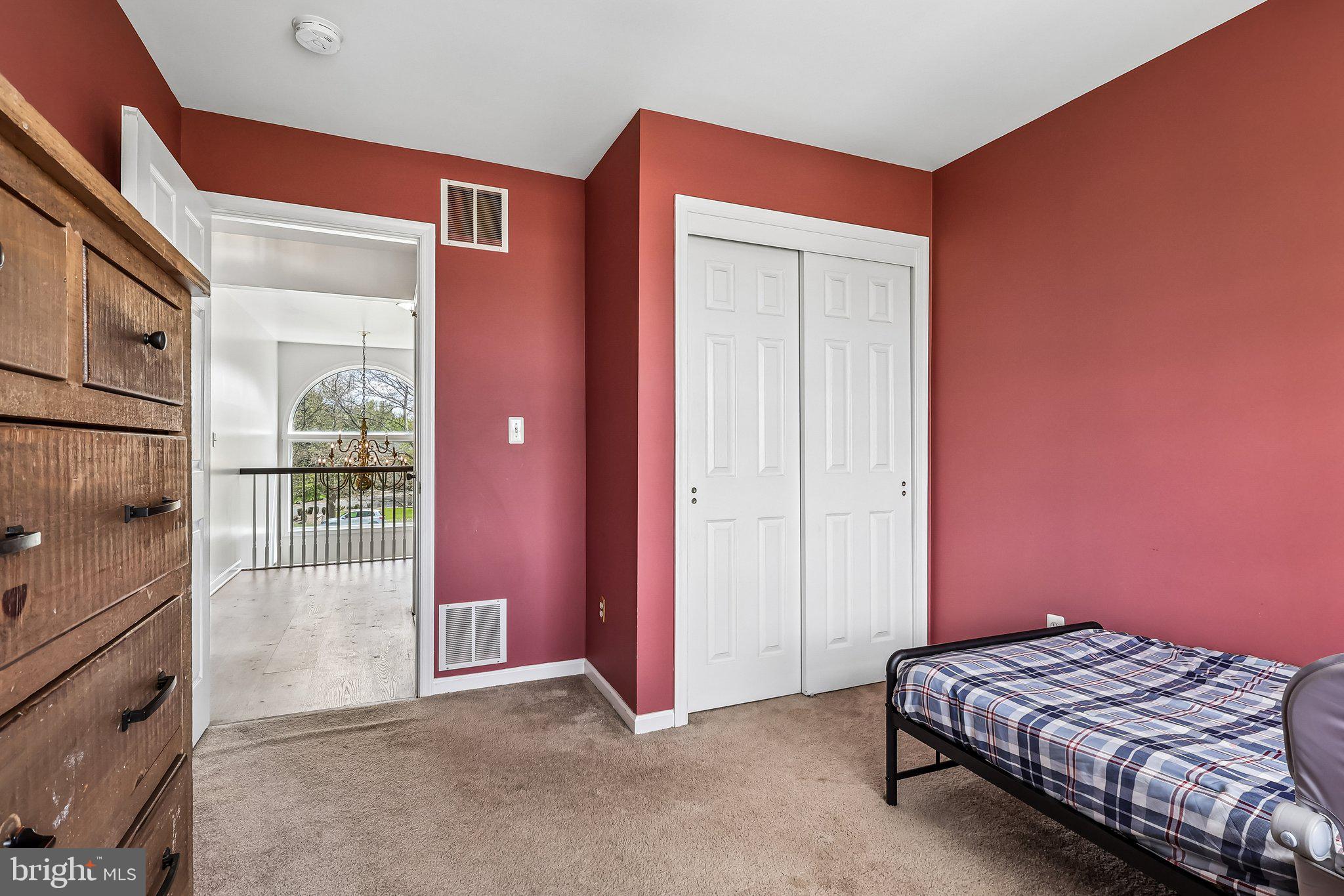 2 Carney Way Hamilton, NJ 08620 - Photo 36 of 72 a bedroom with a bed and a mirror
