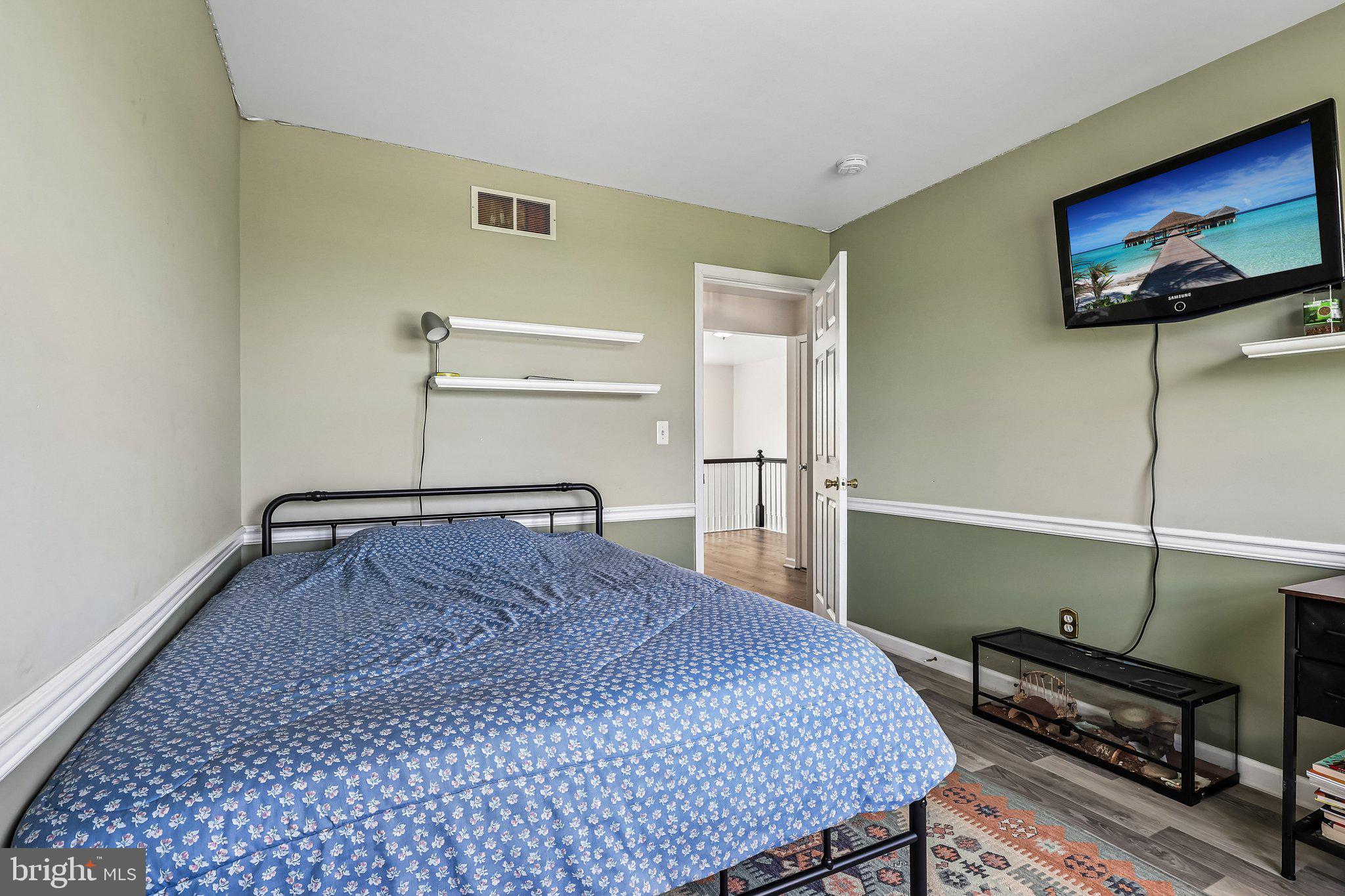 2 Carney Way Hamilton, NJ 08620 - Photo 38 of 72 a bedroom with a bed and a flat screen tv