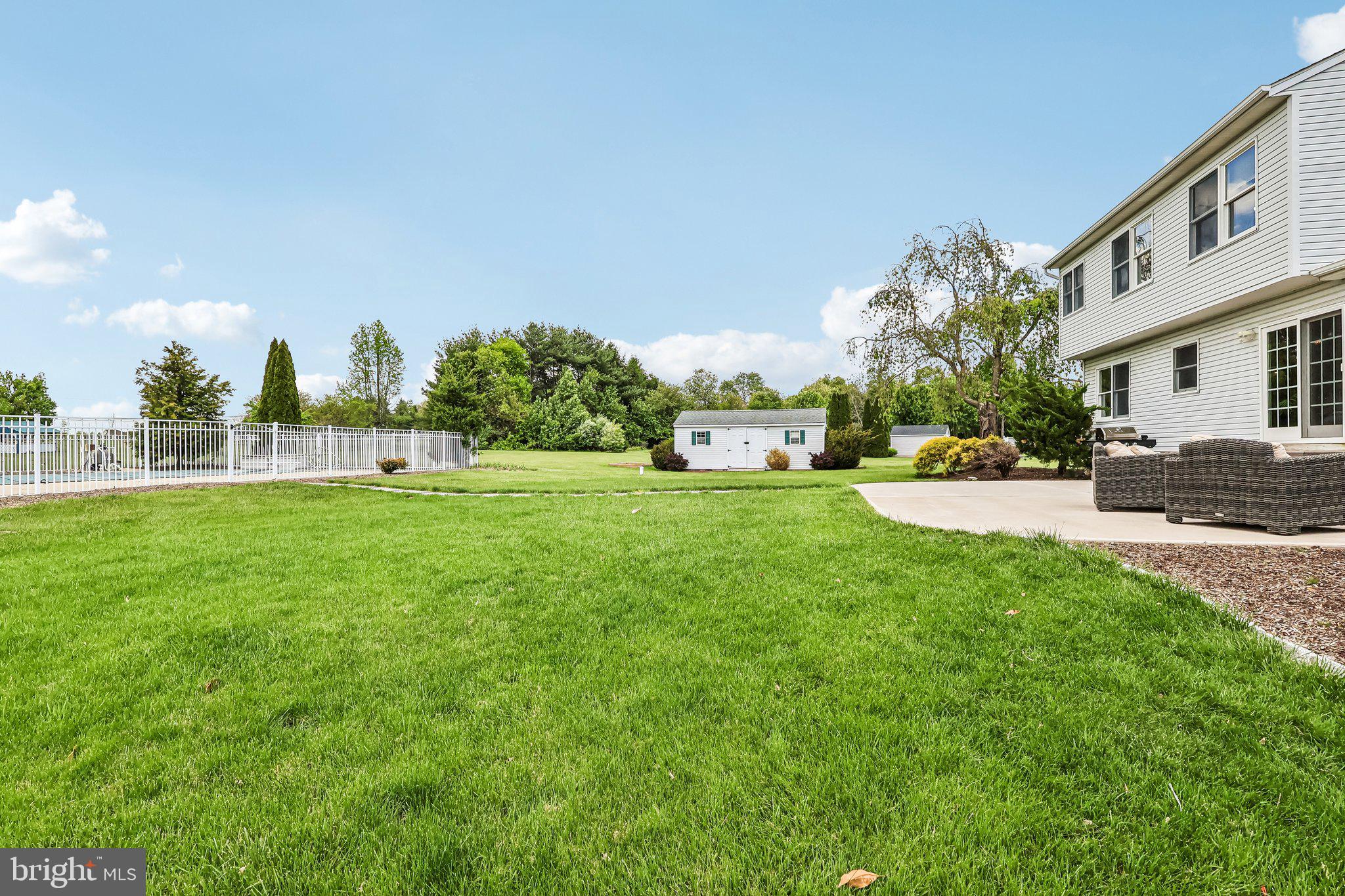 2 Carney Way Hamilton, NJ 08620 - Photo 49 of 72 a view of a white house in front of a big yard with plants and large trees