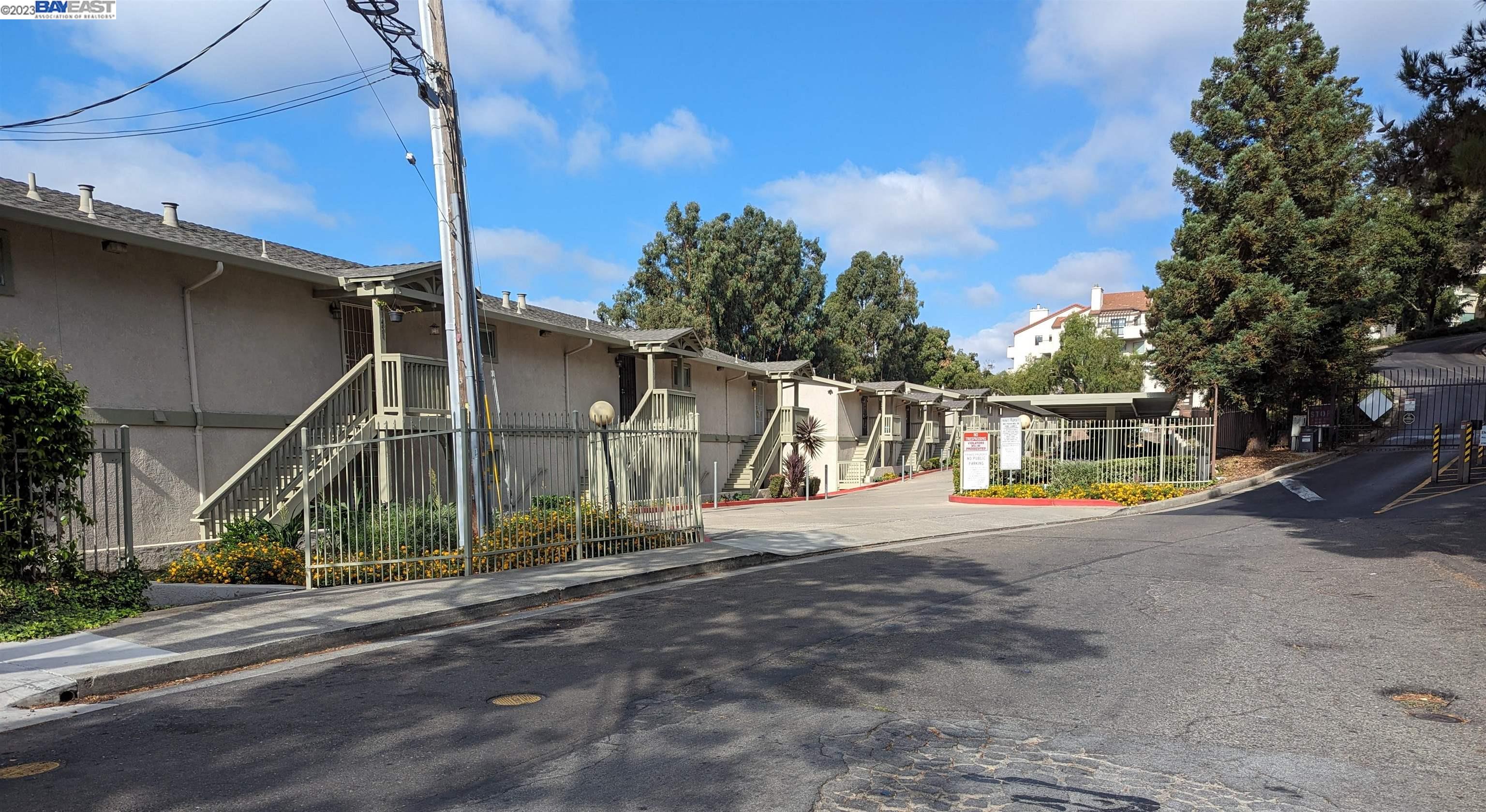 a view of street with large trees