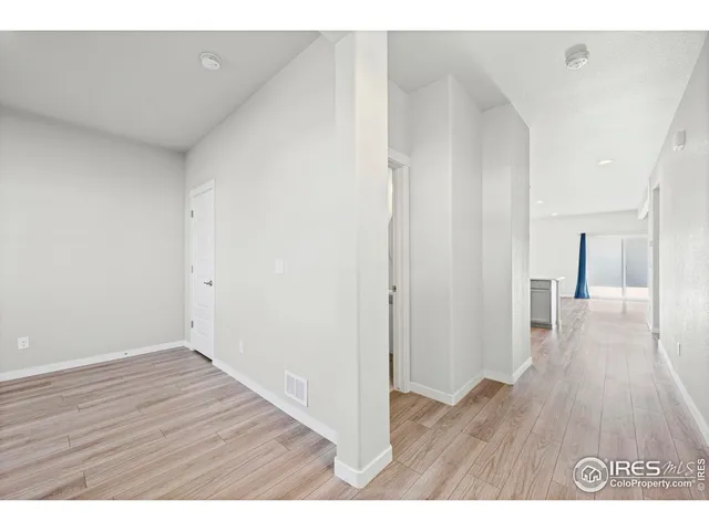 a empty room with wooden floor