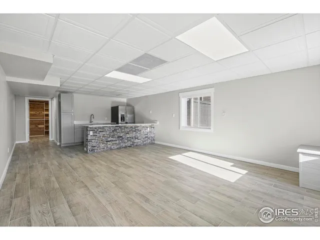 a living room with a couch and a window