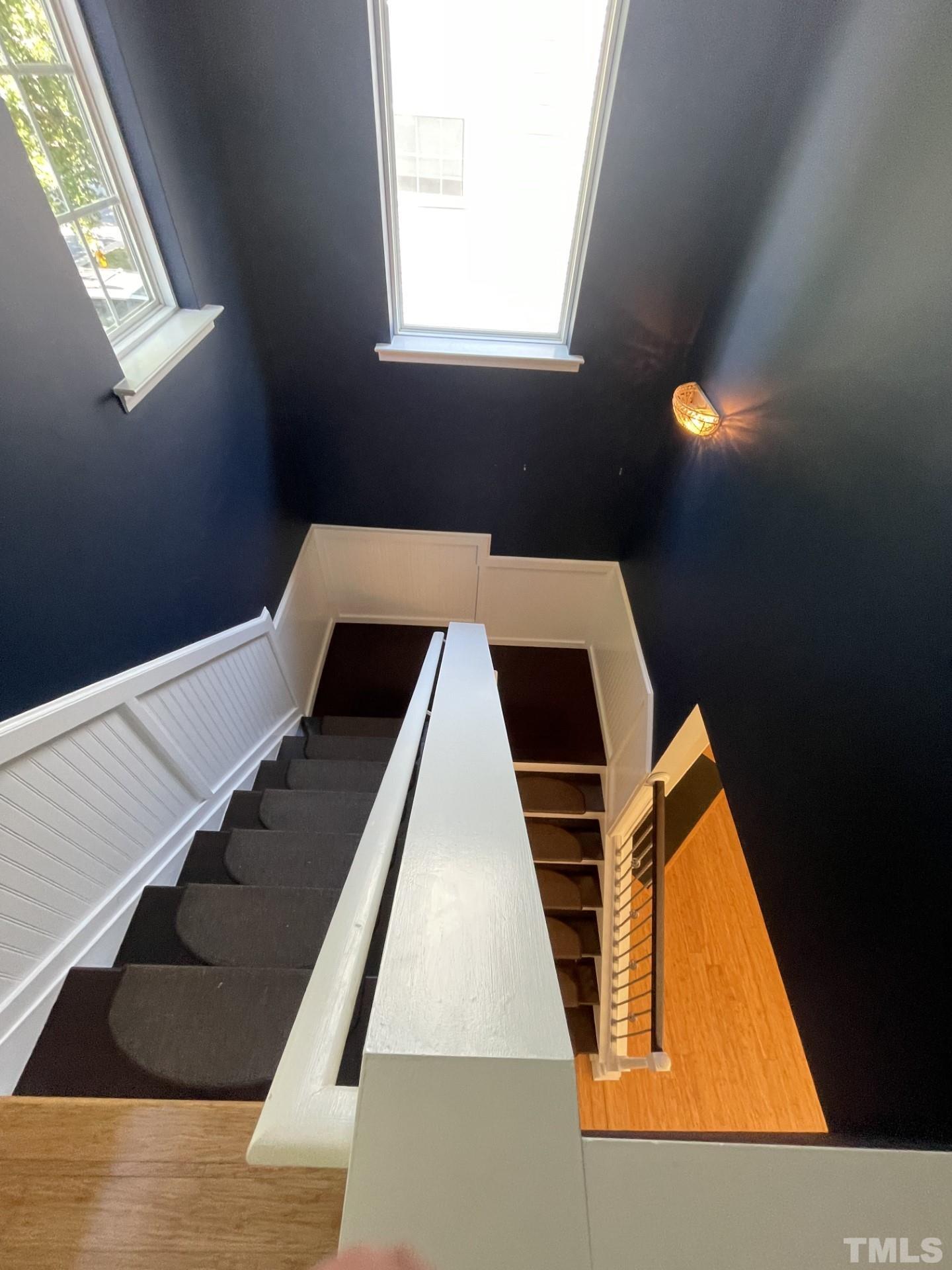 152 Solheim Lane Raleigh, NC 27603 - Photo 20 of 25 a view of staircase with wooden floor and window
