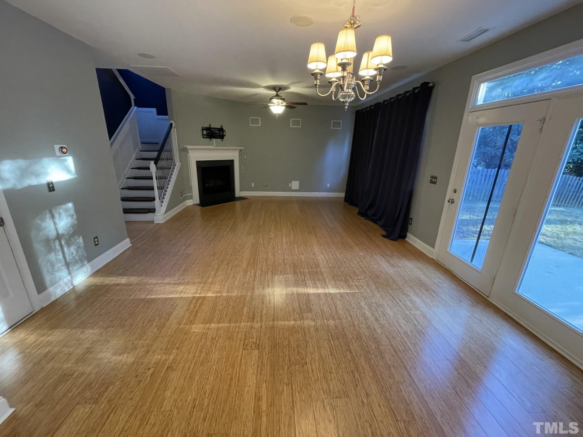 152 Solheim Lane Raleigh, NC 27603 - Photo 25 of 25 a view of a room with wooden floors and chandelier