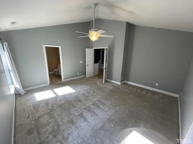 a view of a livingroom with a chandelier fan