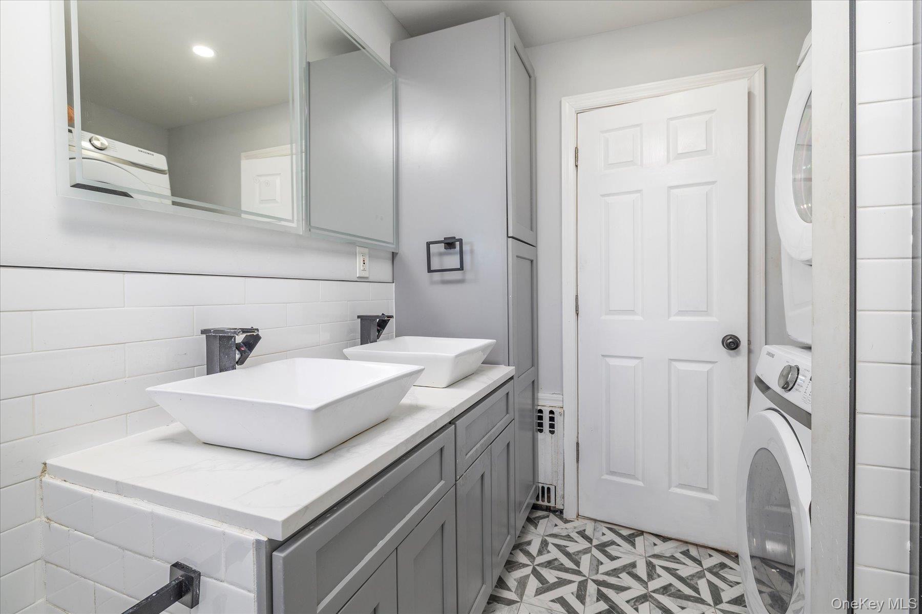 3447 Steven Road Baldwin, NY 11510 - Photo 11 of 23 a bathroom with a sink a toilet and shower