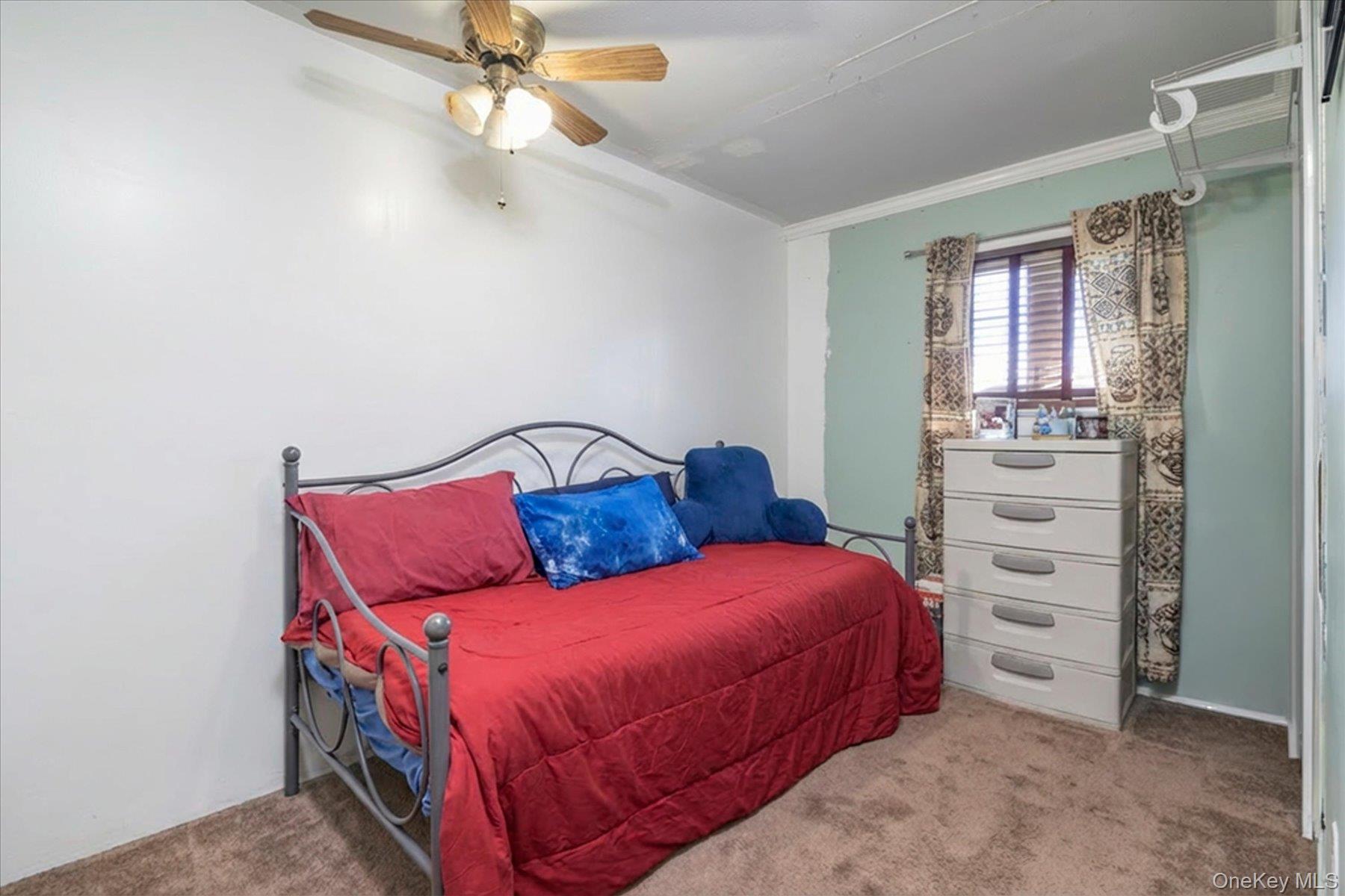 3447 Steven Road Baldwin, NY 11510 - Photo 13 of 23 a bedroom with a bed and a window