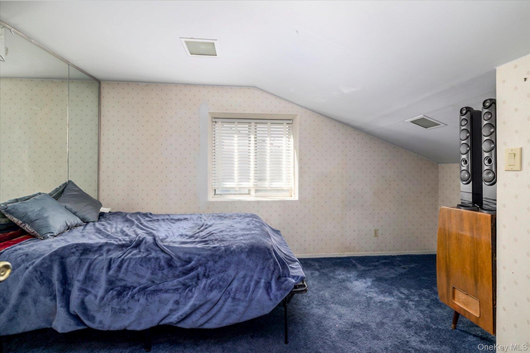 3447 Steven Road Baldwin, NY 11510 - Photo 14 of 23 a bedroom with a bed and window