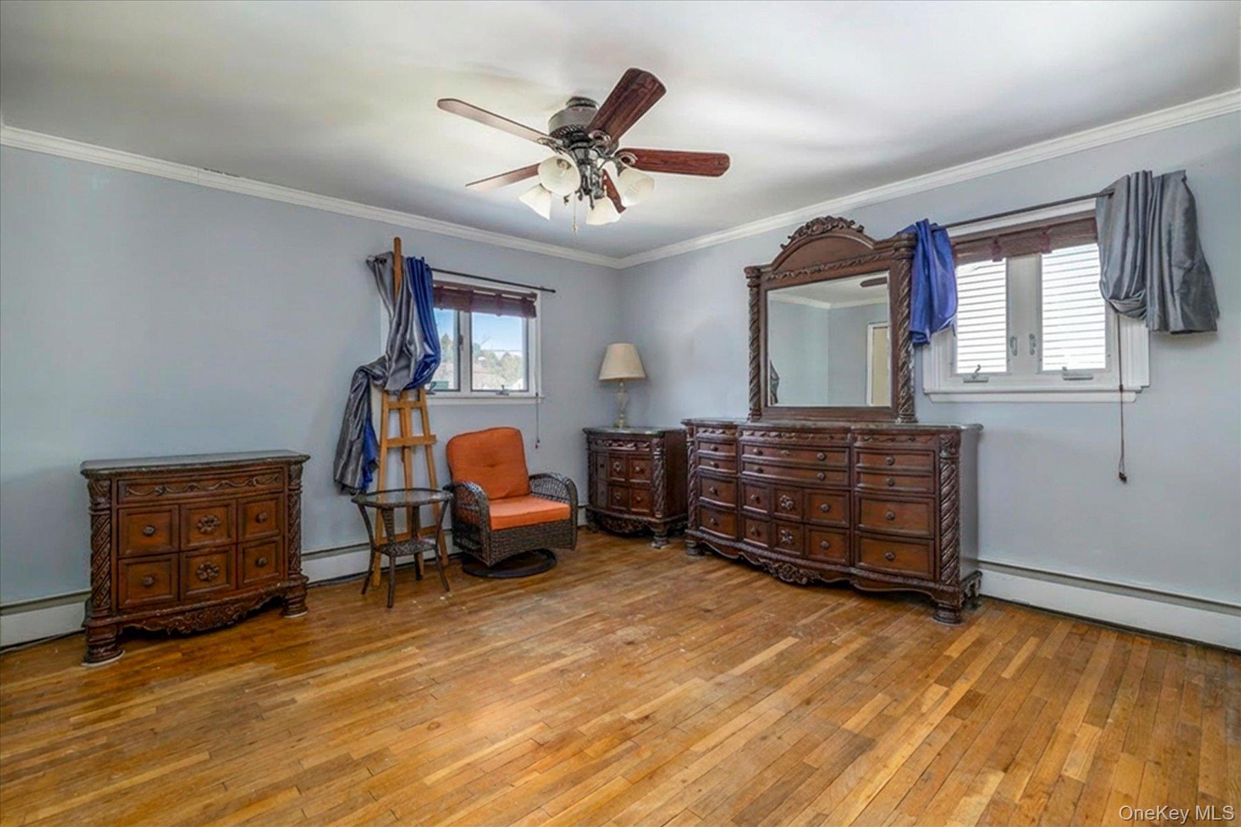 3447 Steven Road Baldwin, NY 11510 - Photo 15 of 23 a bedroom with a bed and wooden floor