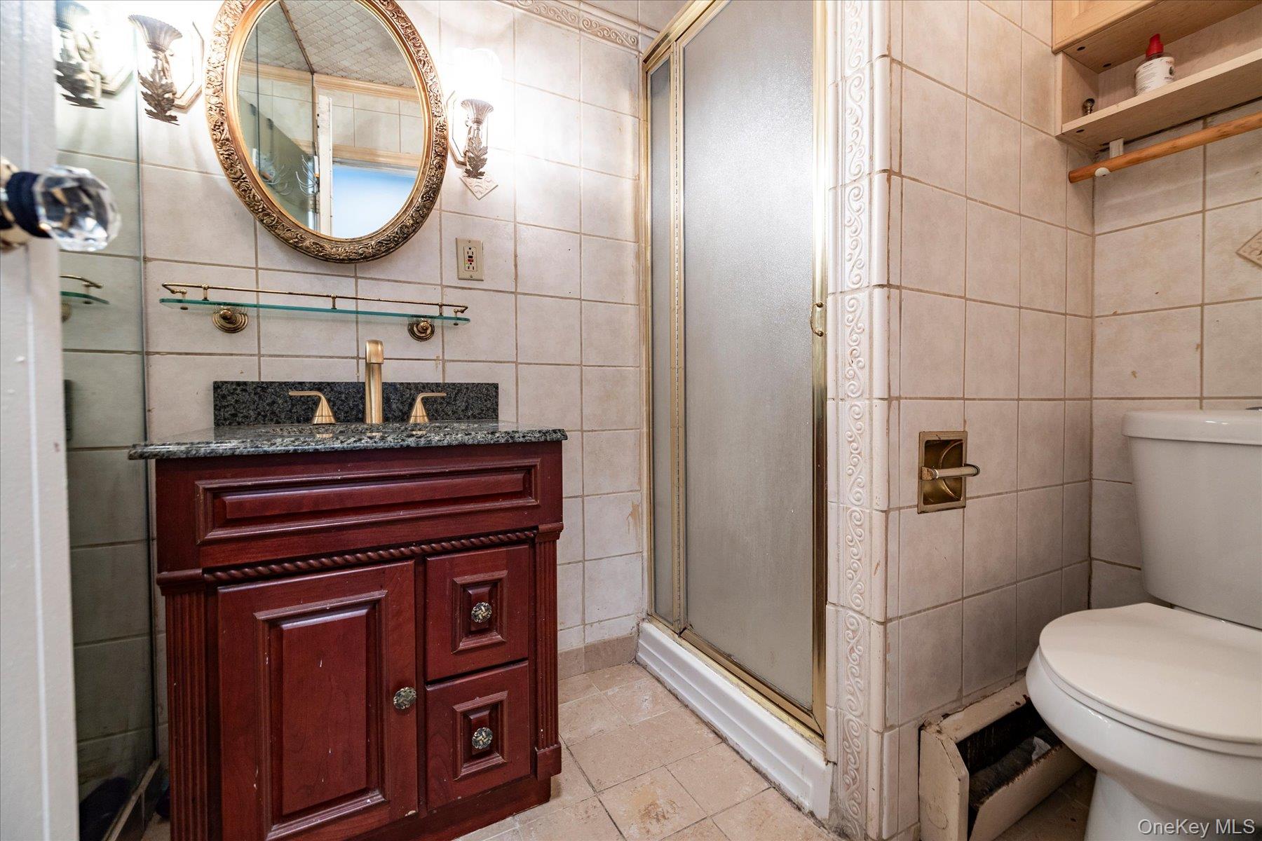 3447 Steven Road Baldwin, NY 11510 - Photo 16 of 23 a bathroom with a toilet and a mirror