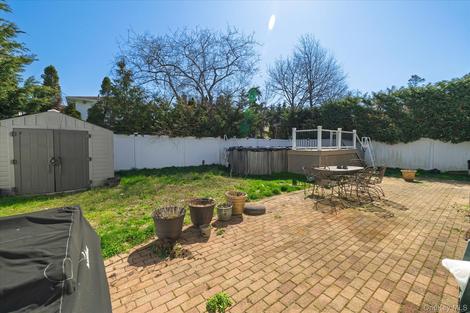 3447 Steven Road Baldwin, NY 11510 - Photo 18 of 23 a view of a backyard with wooden fence