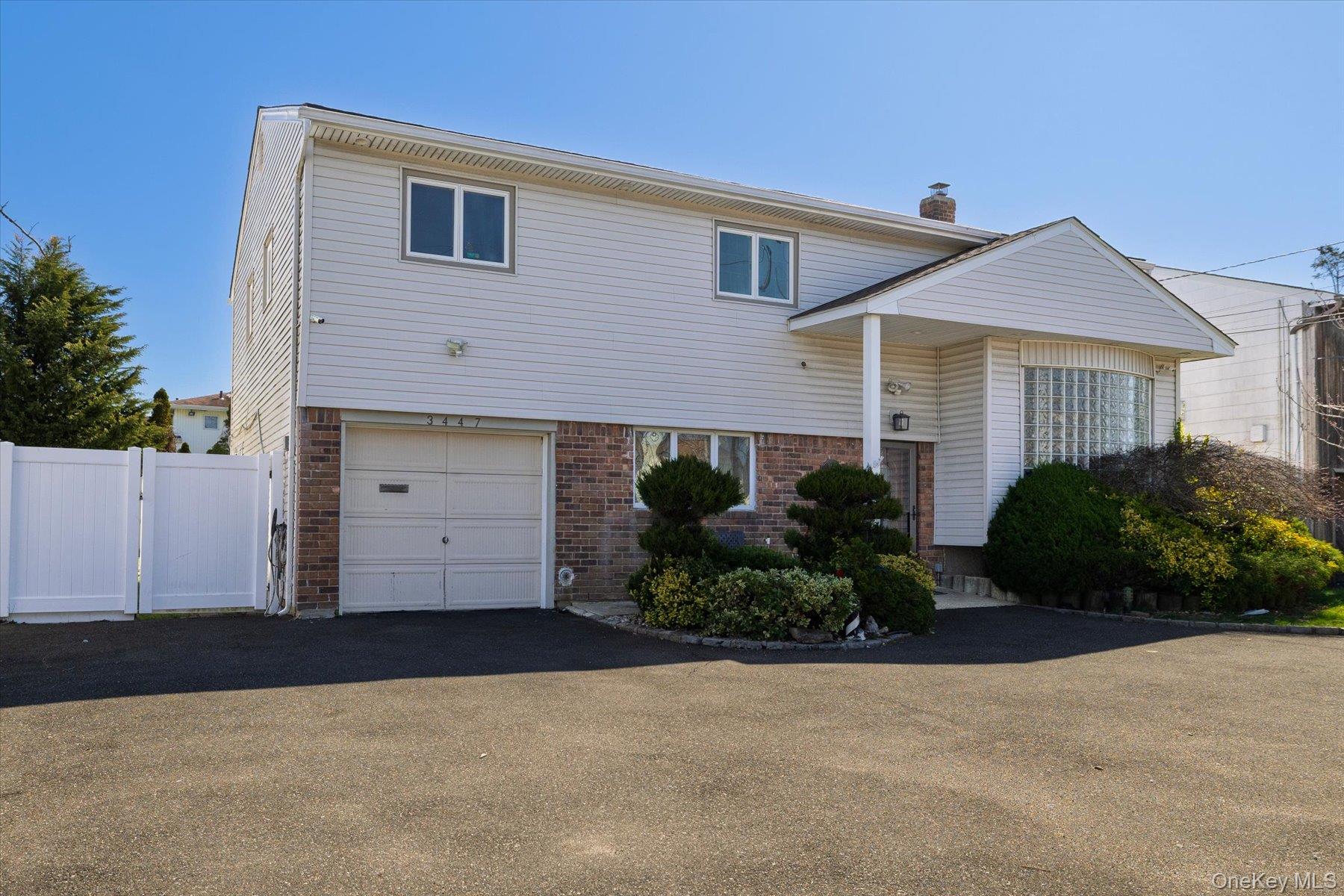 3447 Steven Road Baldwin, NY 11510 - Photo 20 of 23 a view of a house with a yard