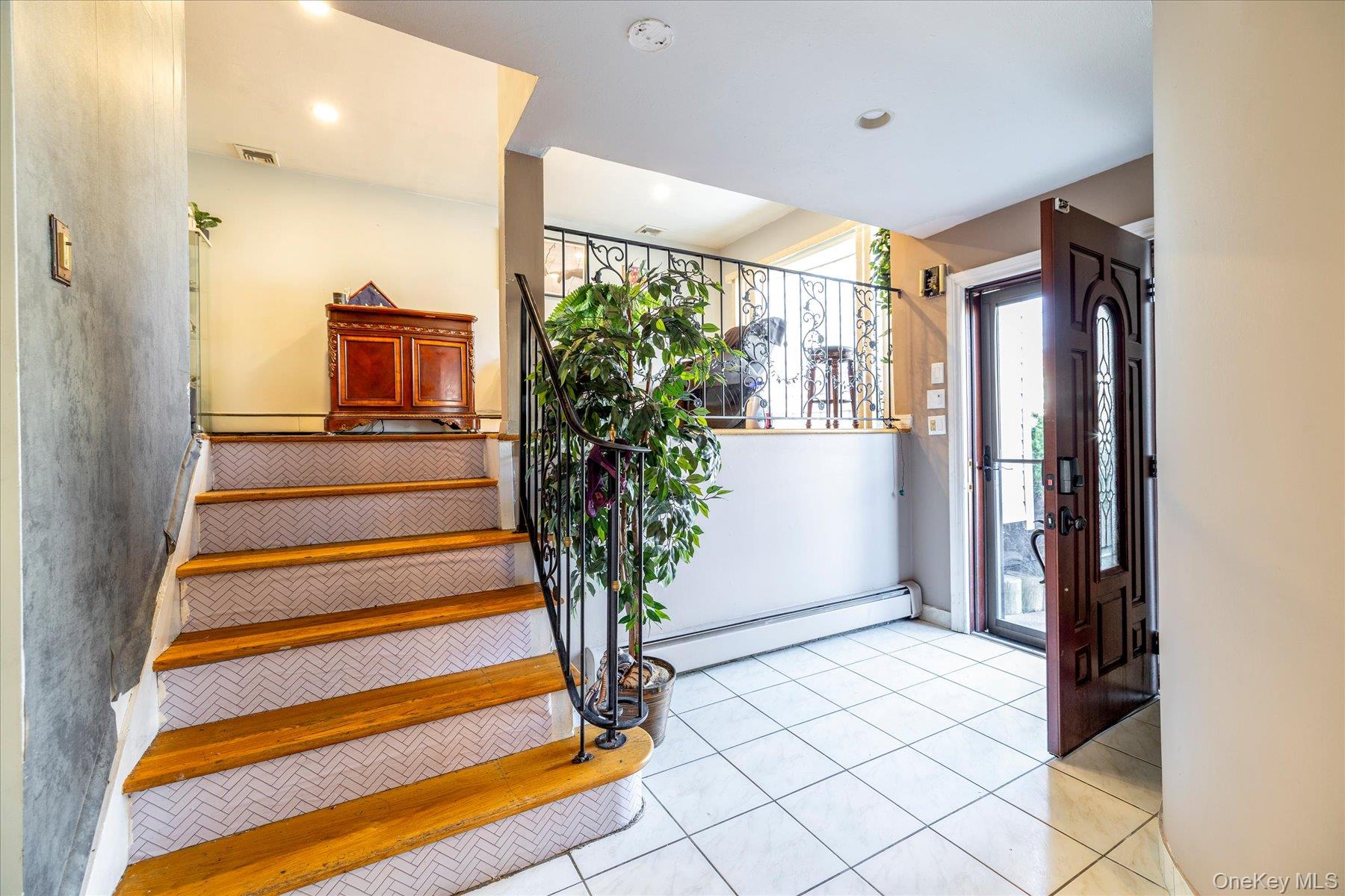 3447 Steven Road Baldwin, NY 11510 - Photo 3 of 23 a view of front door with furniture and a window