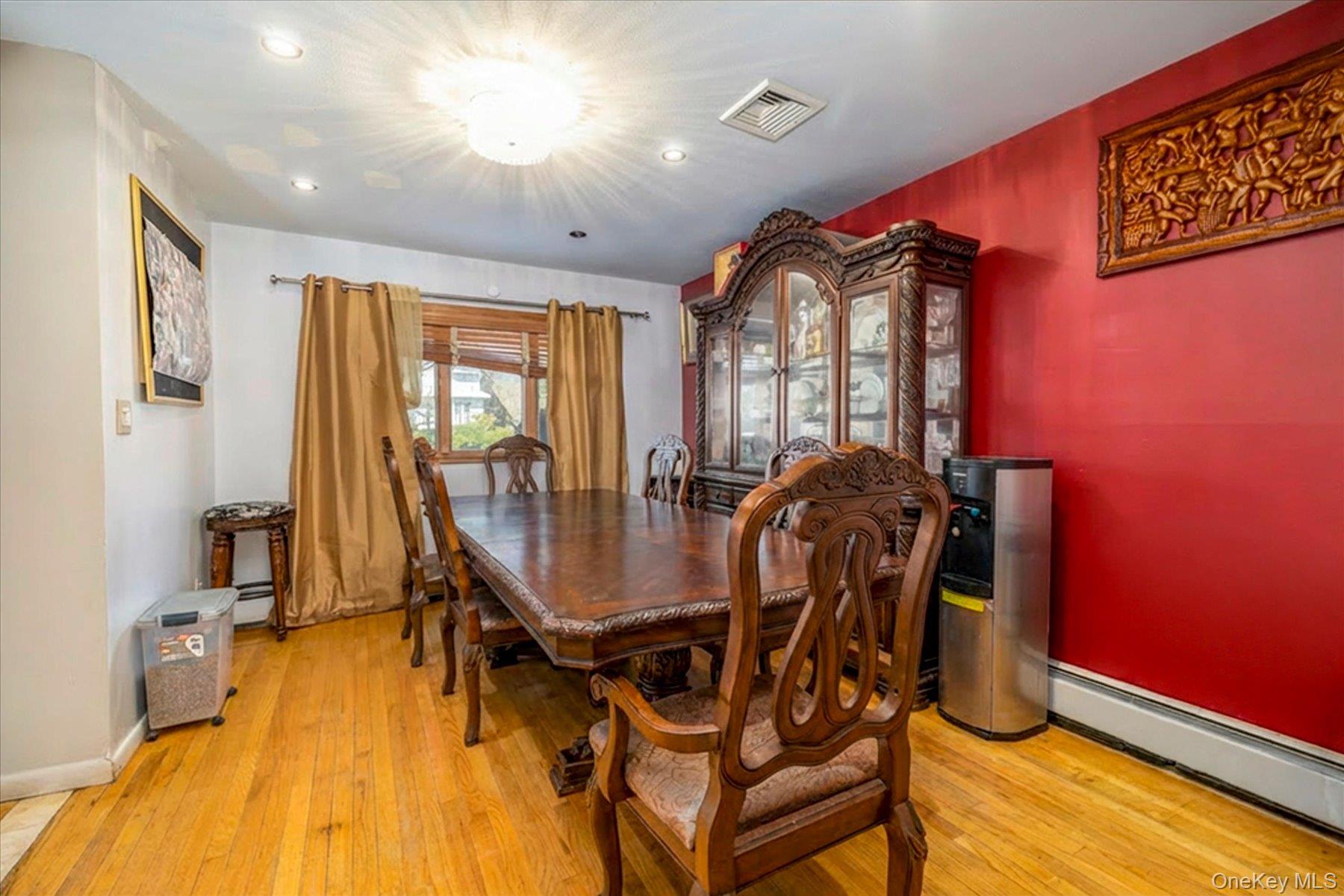 3447 Steven Road Baldwin, NY 11510 - Photo 4 of 23 a dining room with furniture and wooden floor