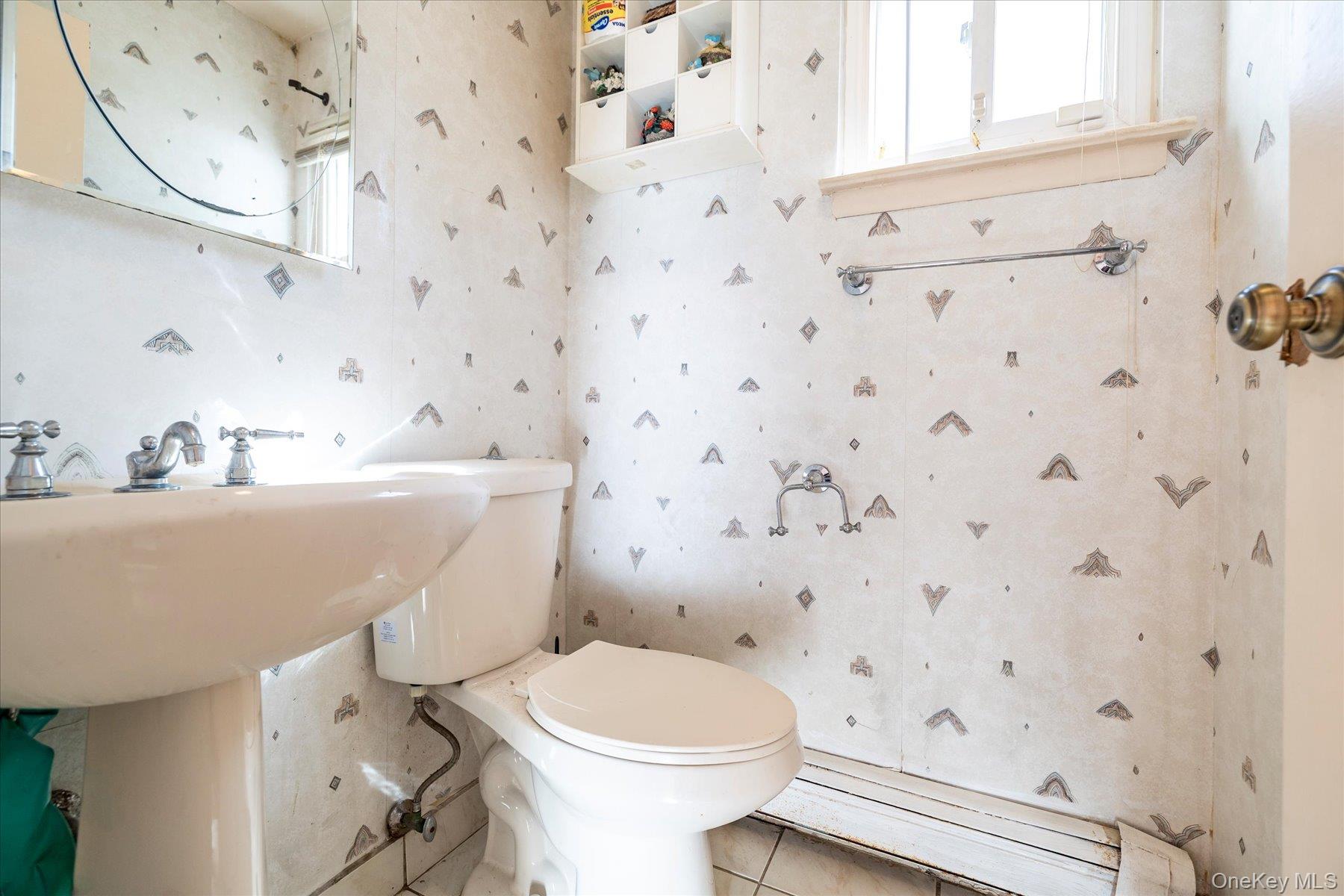 3447 Steven Road Baldwin, NY 11510 - Photo 7 of 23 a bathroom with a sink toilet and shower