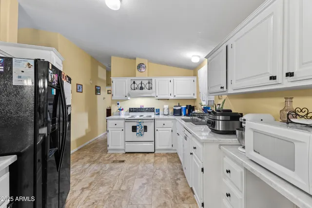 a kitchen with a stove and a refrigerator