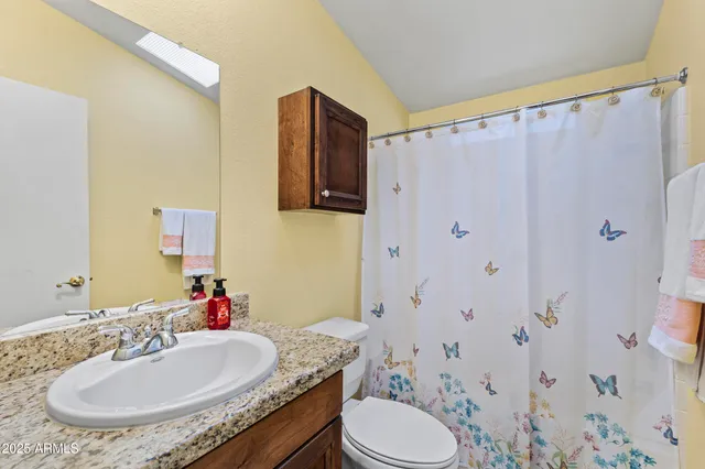 a view of a storage and utility room with washer and dryer