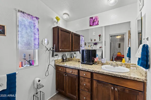 a bed room with a bed and a mirror