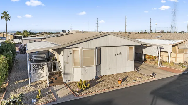 a view of a living room and kitchen
