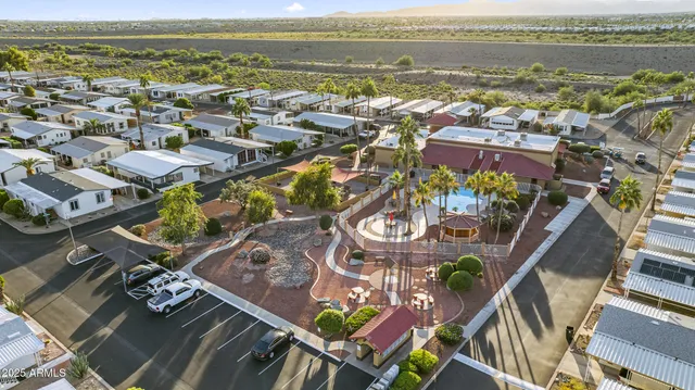 an aerial view of residential building and lake