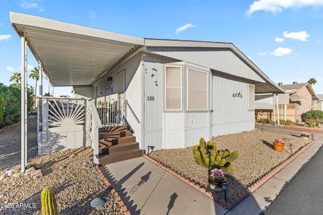 a view of a porch with wooden floor and stairs