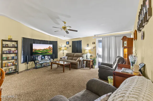 a view of a dining room with furniture wooden floor and chandelier