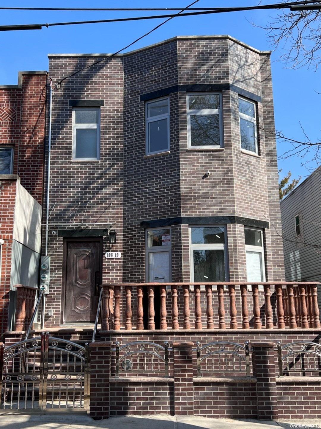 a front view of a house with glass windows