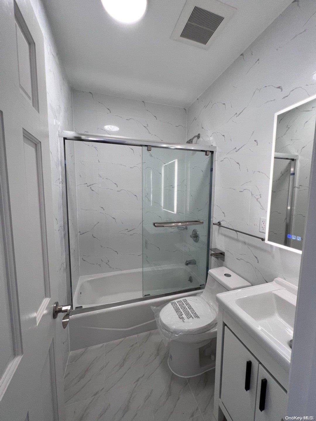 108-19 35th Avenue Queens, NY 11368 - Photo 5 of 7 a bathroom with a sink toilet and shower