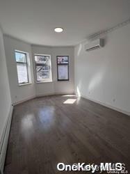 108-19 35th Avenue Queens, NY 11368 - Photo 6 of 7 an empty room with windows