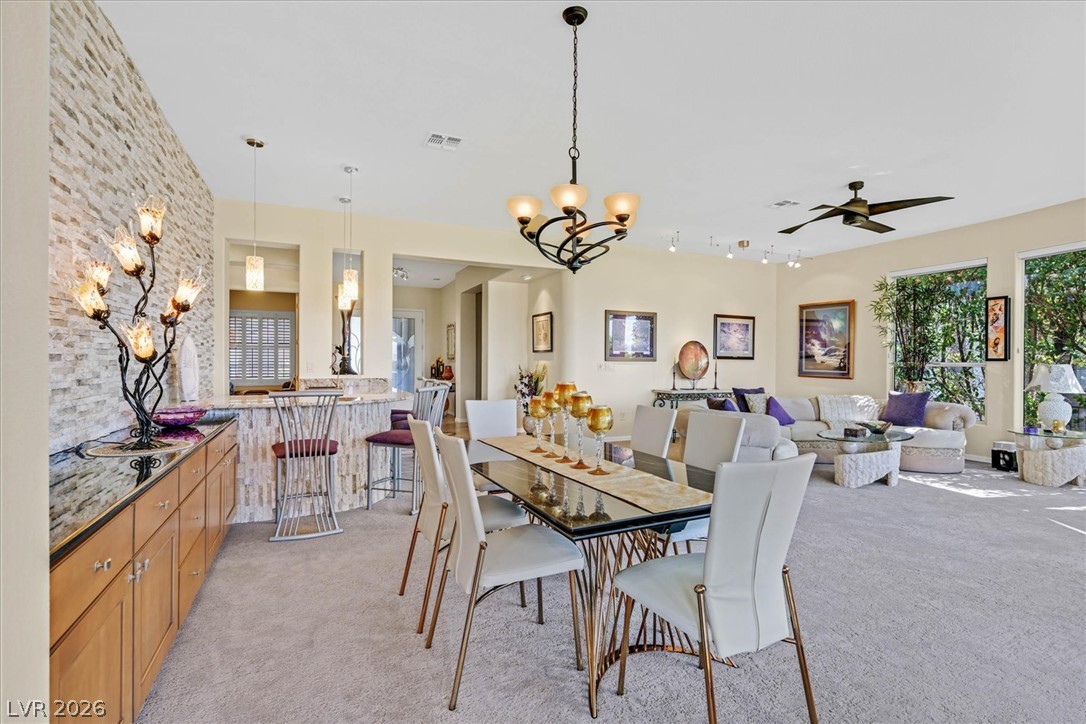 1823 Baton Rouge Street Henderson, NV 89052 - Photo 56 of 60 An open floorplan seamlessly connects the dining area to the living space under tall ceilings.