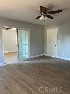 a large white kitchen with a stove a sink dishwasher and cabinets